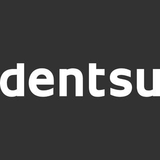White dentsu logo on a black background